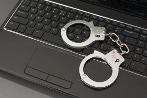 Handcuff Sitting On Top Of A Keyboard