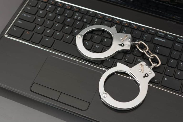 handcuff sitting on top of a keyboard