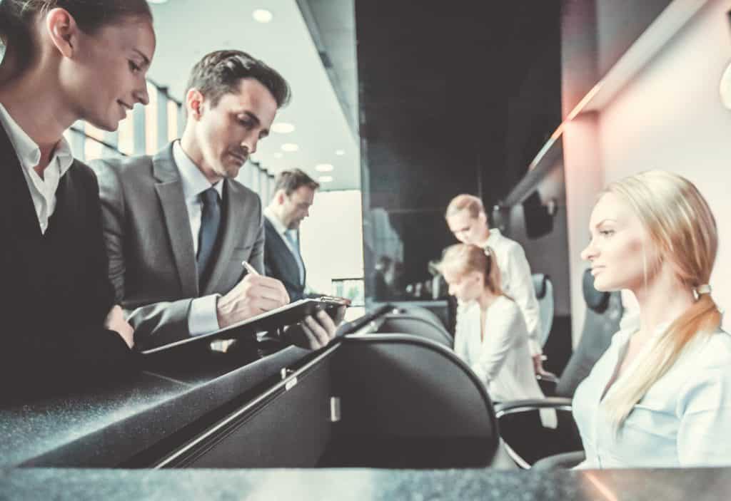 a group of people sitting at a desk